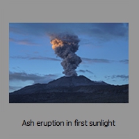 Ash eruption in first sunlight